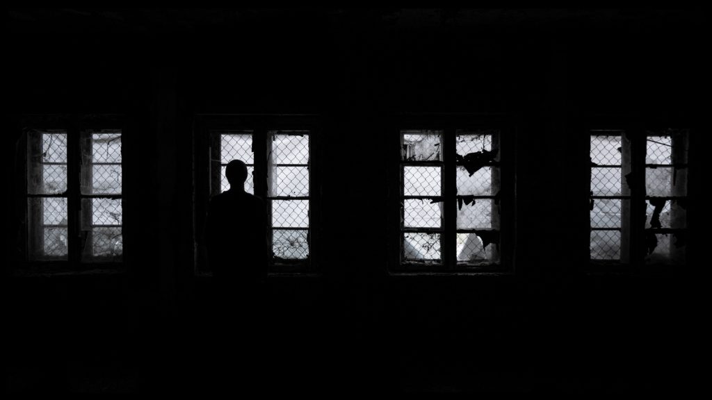 Man at prison window.